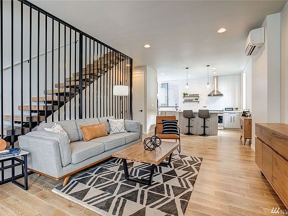 Waterfall railing with open beam wood stairs. Solid hardwoods. 