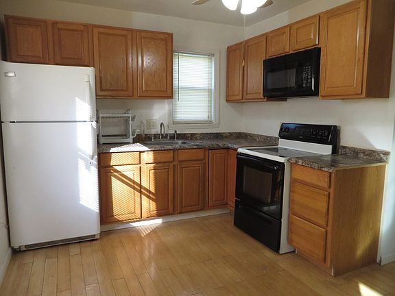 Kitchen with Hardwood Floors and New Oak Cabinets...Ceiling Fan
