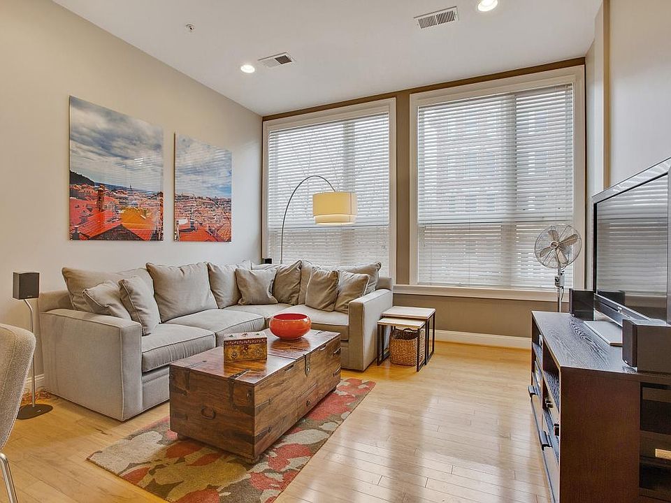 Living Room: high ceilings, full height windows