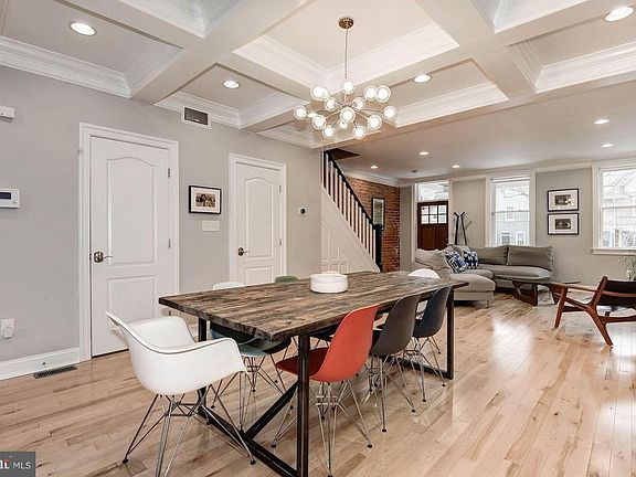 Coffered dining room ceiling breaks up the space.