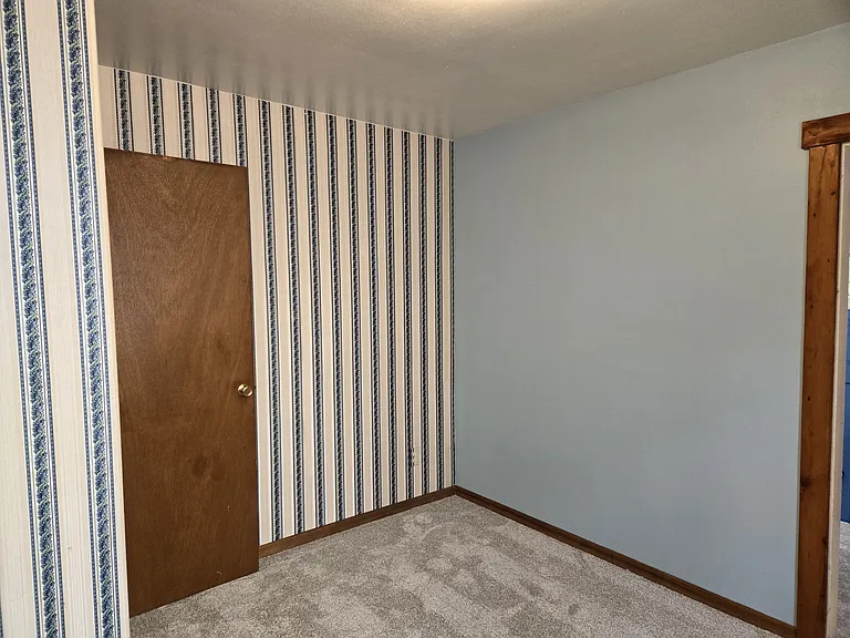 Back Bedroom, door is to Powder Room/Closet.