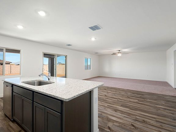 A spacious kitchen island overlooking the living area.