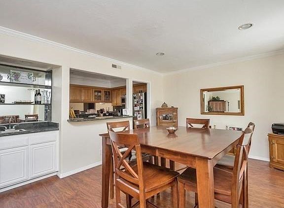 Dining room includes a breakfast bar and a wet bar.