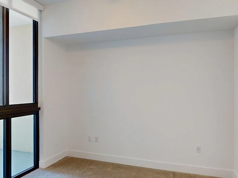 Spacious apartment Bedroom with Carpet Floor.