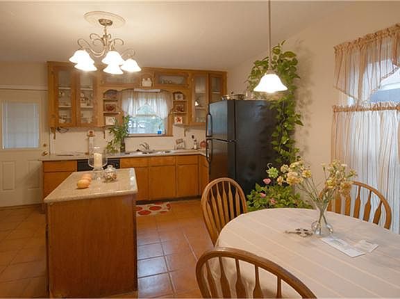 Kitchen has abundant countertops and cabinets