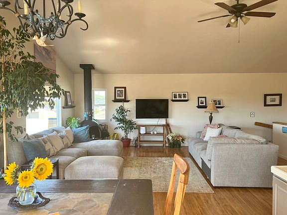 Sofas will stay and can be re-arranged into an L-shape.