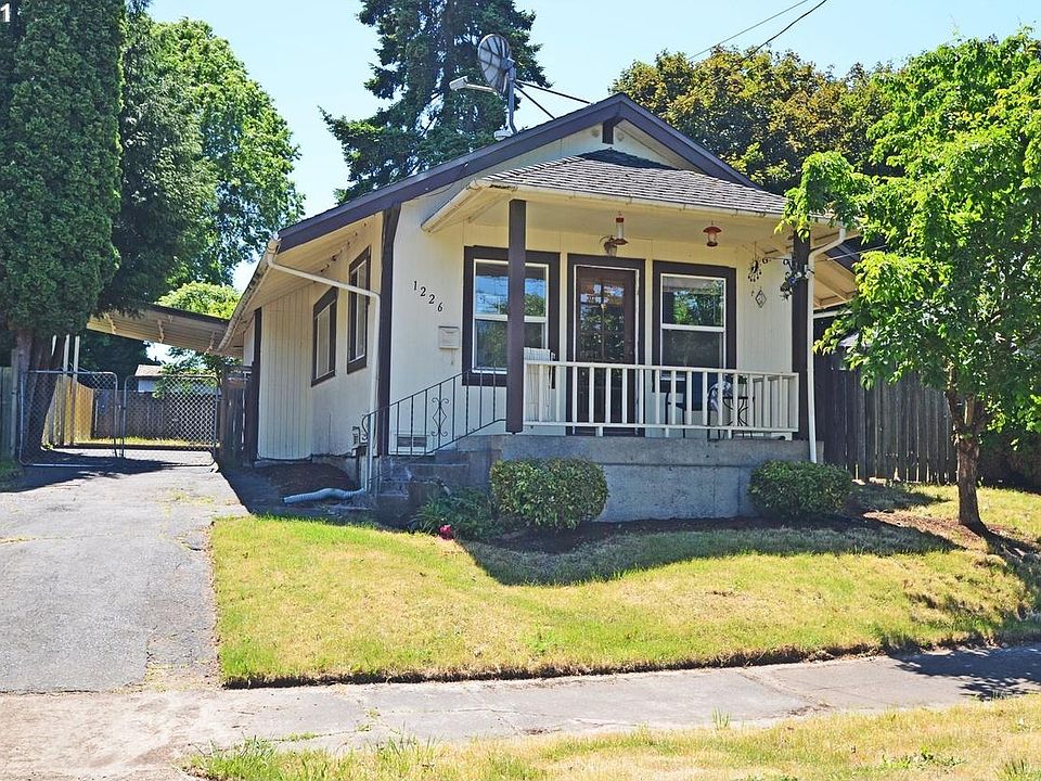 Home with Driveway, front porch and Back Gate