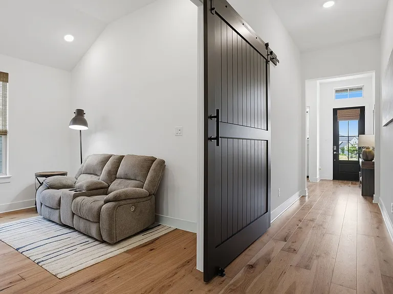 Barn door privacy leads to this awesome flex space for a home office/entertainment room/playroom/home school/fitness room. Unlimited possibilities!