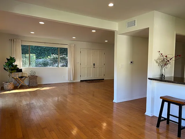 Facing the double front doors to the entry.