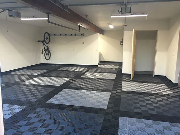 Garage with lots of storage (and wine cellar)