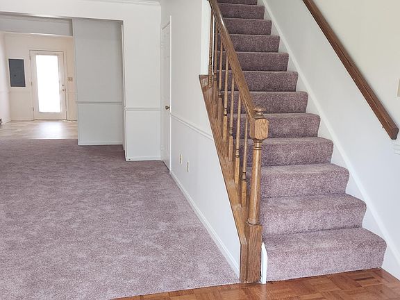 Entryway looking into living room and dining area