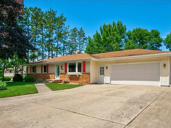 2 1/2 stall heated garage with extra driveway parking and a shed for more storage.