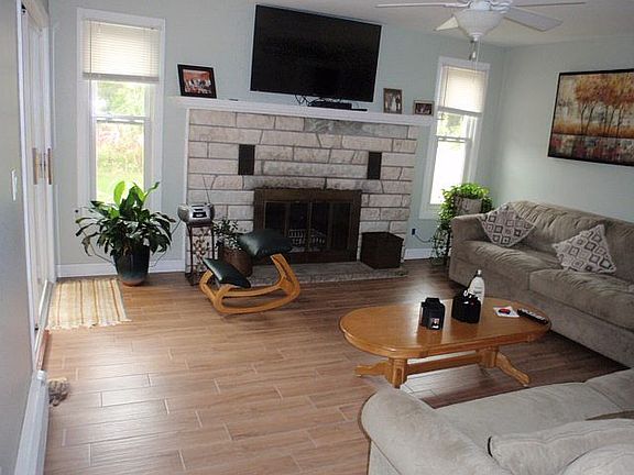 Den with marble fireplace