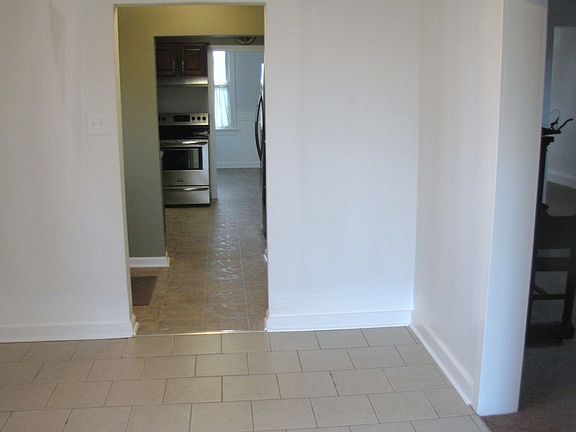 view from office w/ half bath to kitchen
