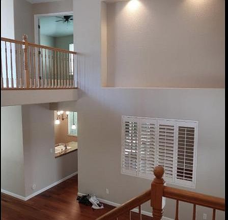 Passage going to kitchen, and part of it is formal living room. Window is between formal living room and family room.