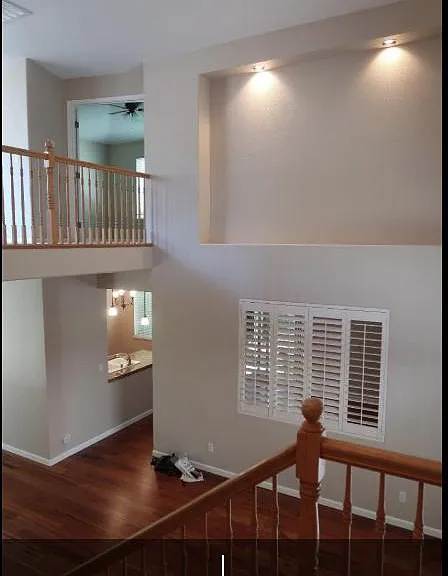 Passage going to kitchen, and part of it is formal living room. Window is between formal living room and family room.