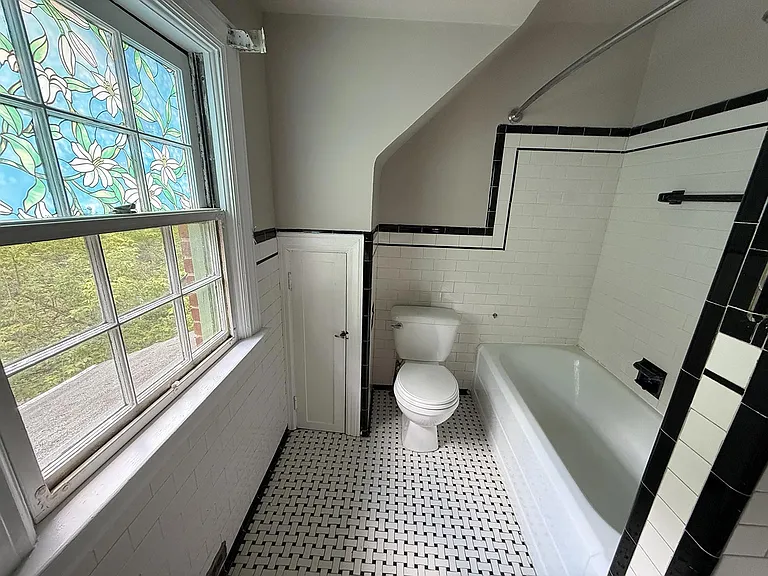 Original black and white basketweave tile bath.