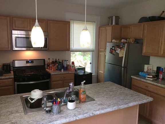 Kitchen with breakfast bar and stainless steel appliances