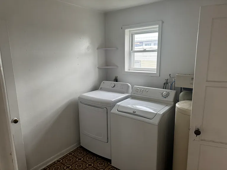 laundry room , there is a pantry to the left , and another storage/ office area to the right