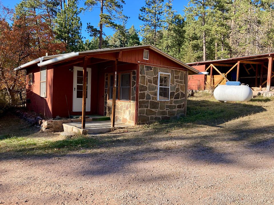 cabin, and to the right is carport for parking.