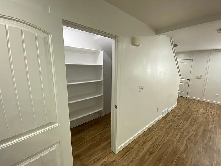 Crawl space opening inside pantry