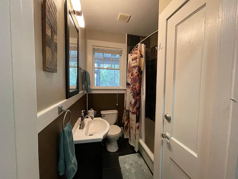 Bathroom has full tub and shower.