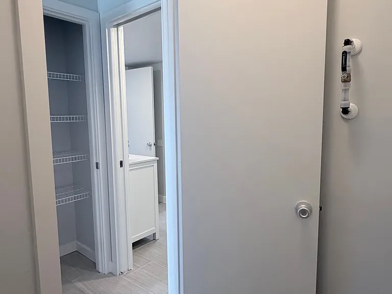 Inside of the extra storage utility closet + an extra linen closet across the way!