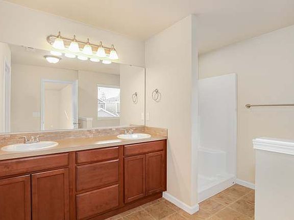 His and her sinks in master bathroom