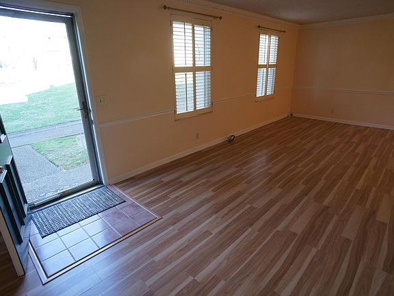 Entrance to large Living Room with wood shutters