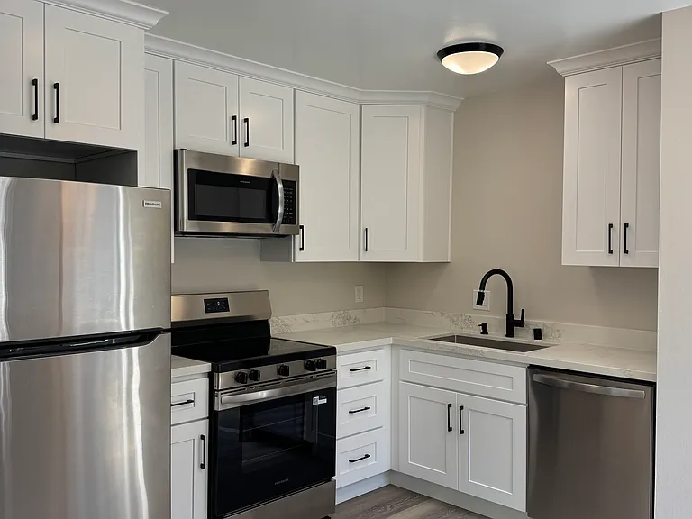 Completely renovated kitchen with new appliances, cabinets and countertops