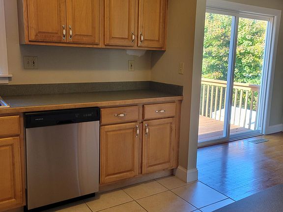 Kitchen with open access to dining room and porch.