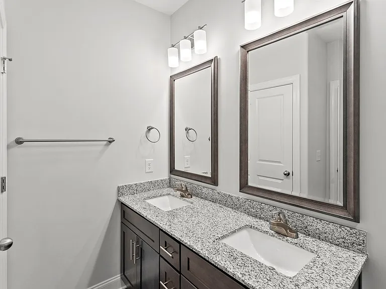 Large bathrooms with granite countertops and large vanities
