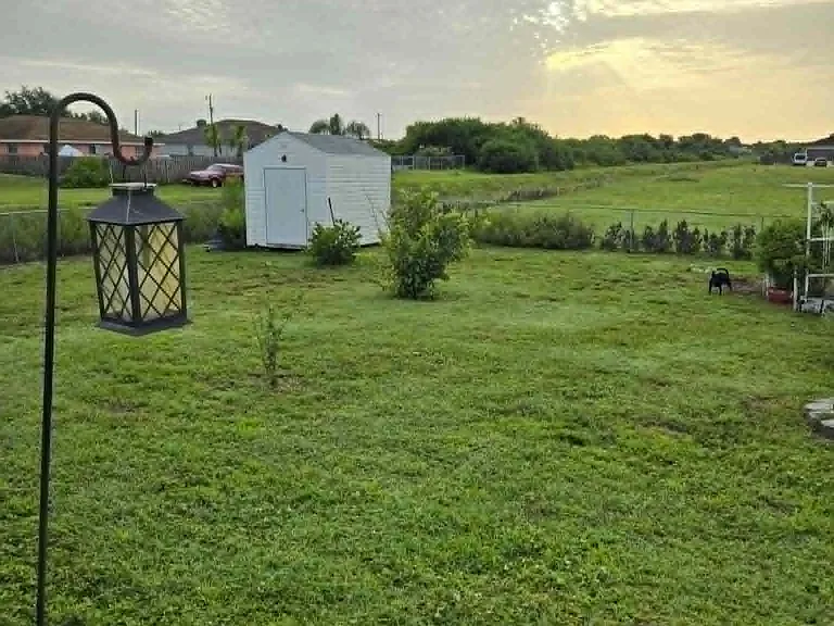 Spacious backyard area with plenty of room to relax and enjoy the outdoors. Perfect for unwinding, spending time outside, reading, or enjoying the peaceful Florida weather.