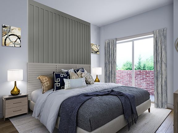 The primary bedroom provides a serene space to unwind.