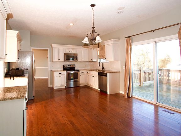 Breakfast Area Adjacent to Kitchen with Access to Deck