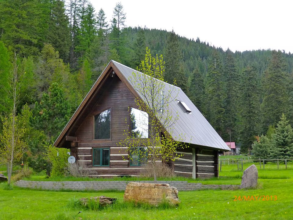 12 inch Hand-Hewn Log Cabin on a 6 acer lot.