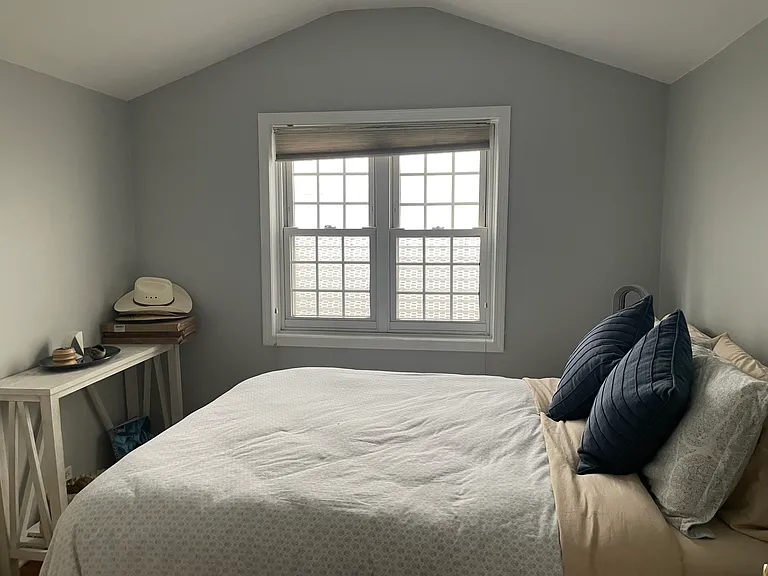 Spacious second bedroom with room for a queen-size bed, dresser, and generous closet space.