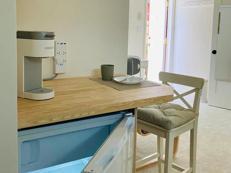 refrigerator and breakfast/lunch/dining area