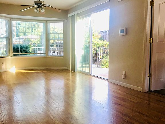 Open family room with space for kitchen table. Sliding door to back yard patio.