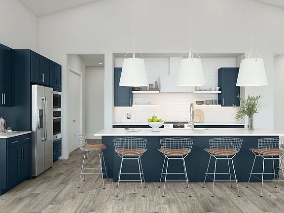 Kitchen featuring vast island pendant lights