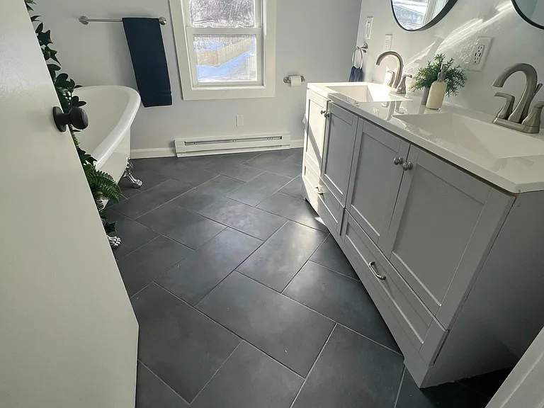 Double vanities and a clawfoot tub make this the perfect sanctuary at the end of a long day.