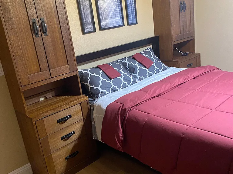 Furnished bedroom bed and cabinets