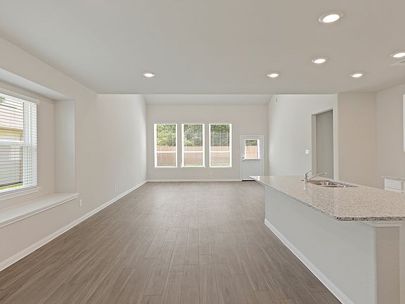 Kitchen and Dining Area to Family Room