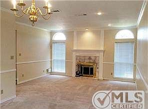 Step from the foyer to find this spacious living room and dining