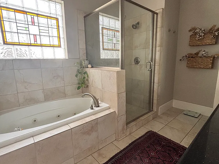 Ensuite master bathroom with double sinks.