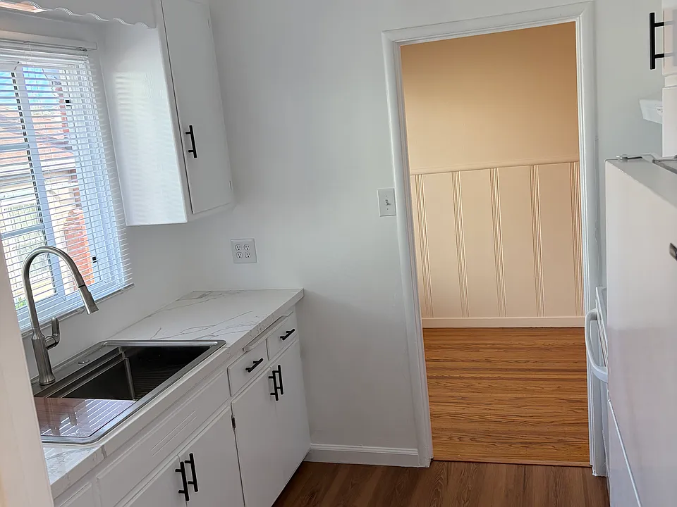 remodeled kitchen with new stove and refrigerator.
