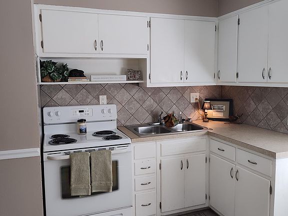 Kitchen with tile backsplash.