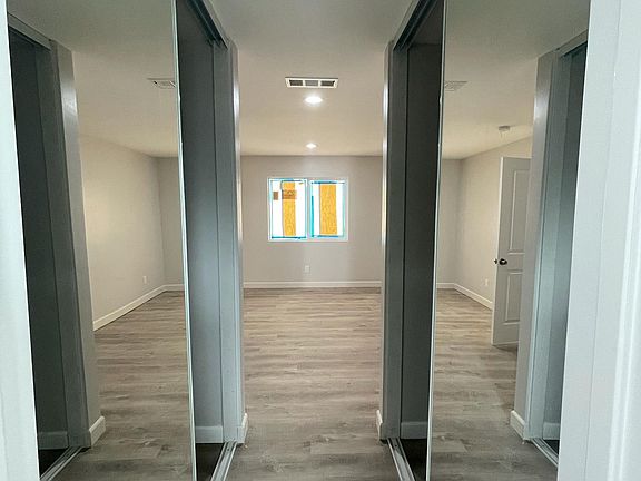 Master bedroom with his and hers closets.