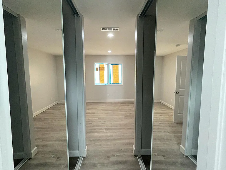 Master bedroom with his and hers closets.