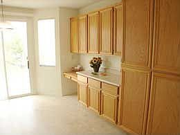 kitchen/dining area with abundant cabinets and built-in desk